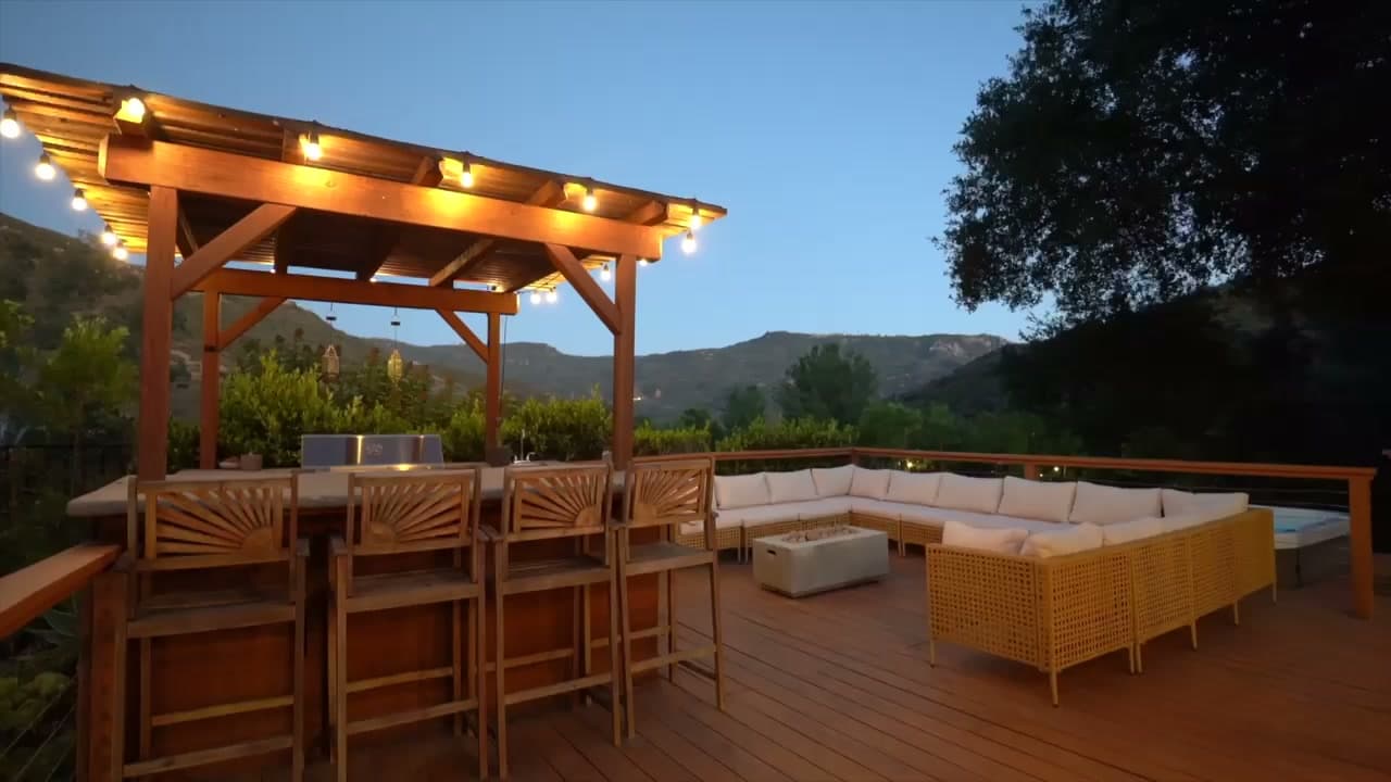 Golden-hour view of the Dreams Awake spa deck, pergola bar, and canyon mountains